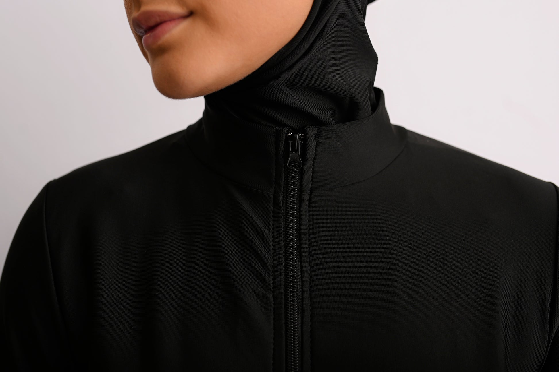 close up of the neck of aqua chic modest swimwear in black