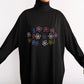 close up of floral motif on blooming black ultra modest swimdress